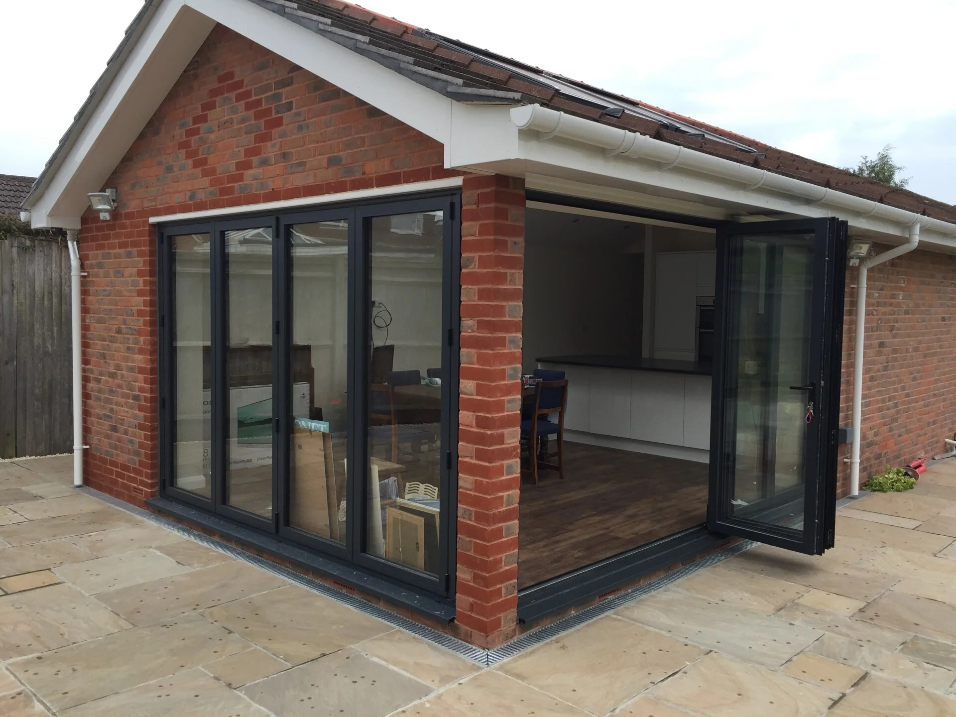 Garage conversion to living space with insulation and bi-fold doors