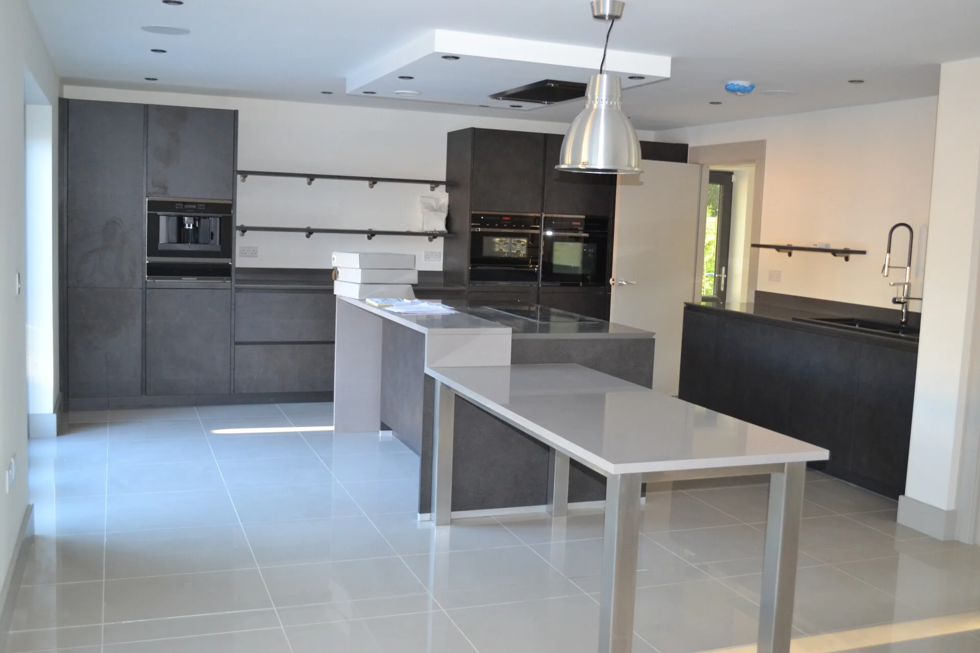 Kitchen diner conversion with bi-fold doors opening to garden
