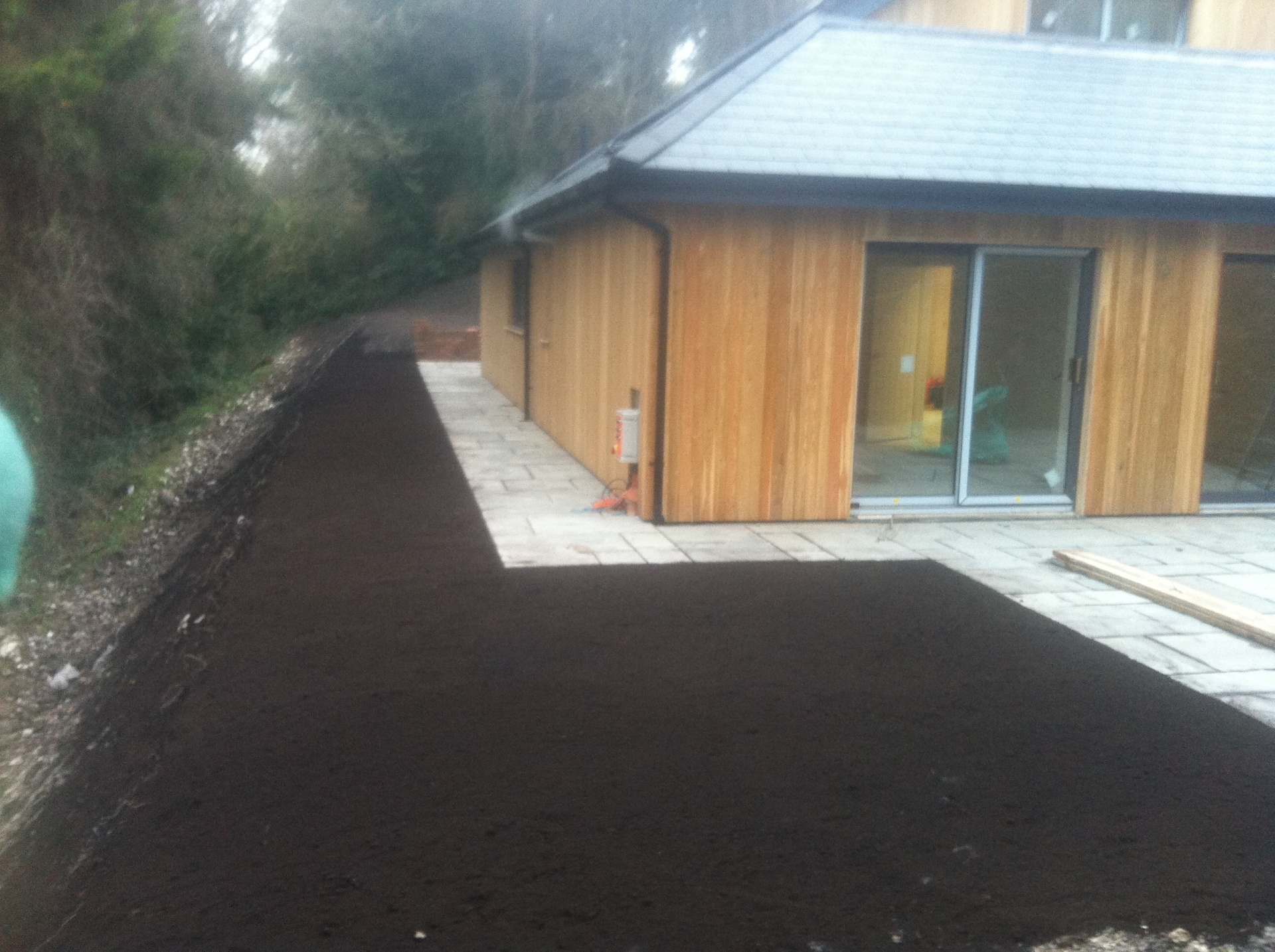 Multi-level decking and patio area with retaining walls