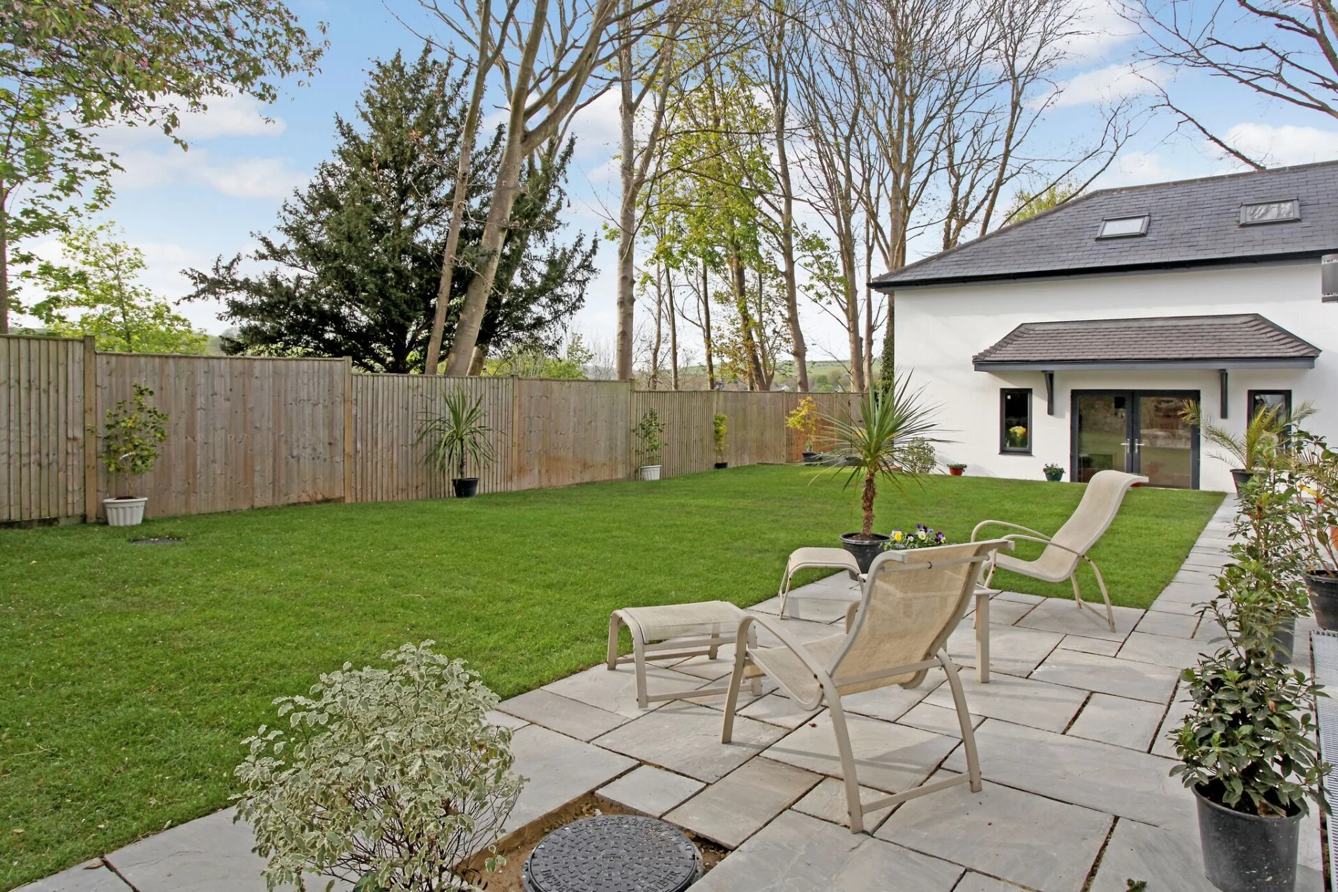 New build rear garden with stone patio and professional landscaping
