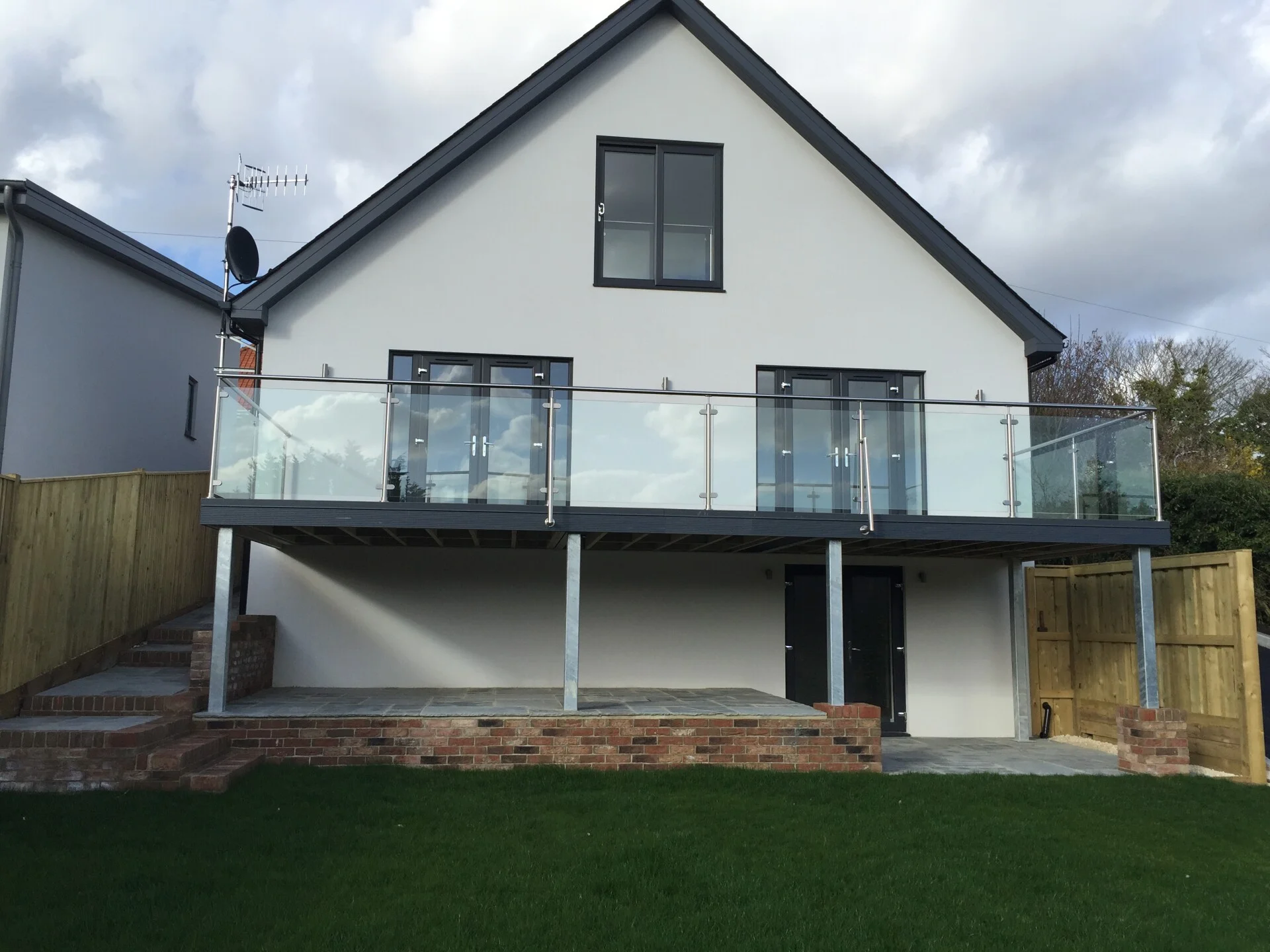 Renovated bedroom with vaulted ceiling and skylight